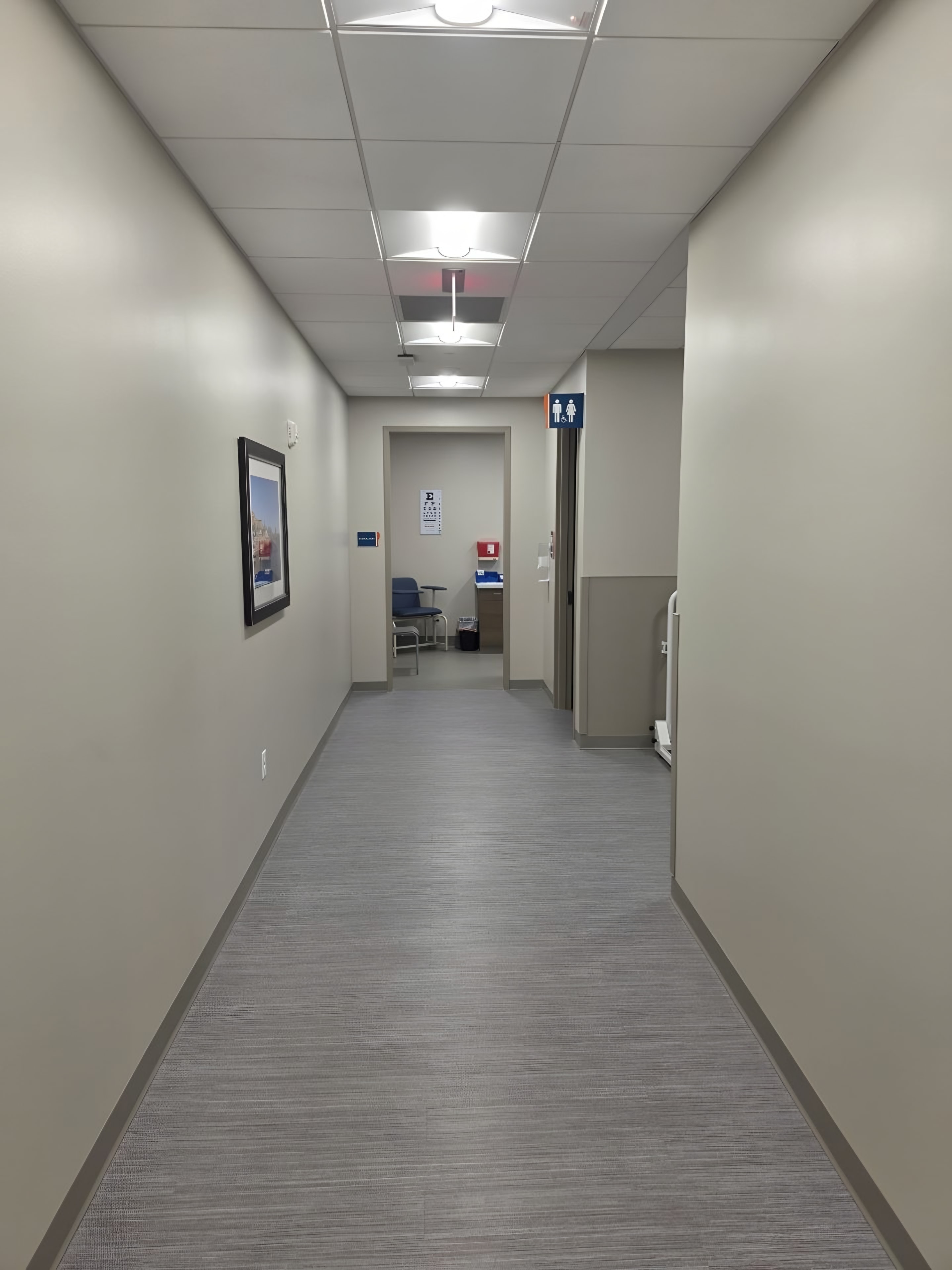 A corridor with painted walls and framed art