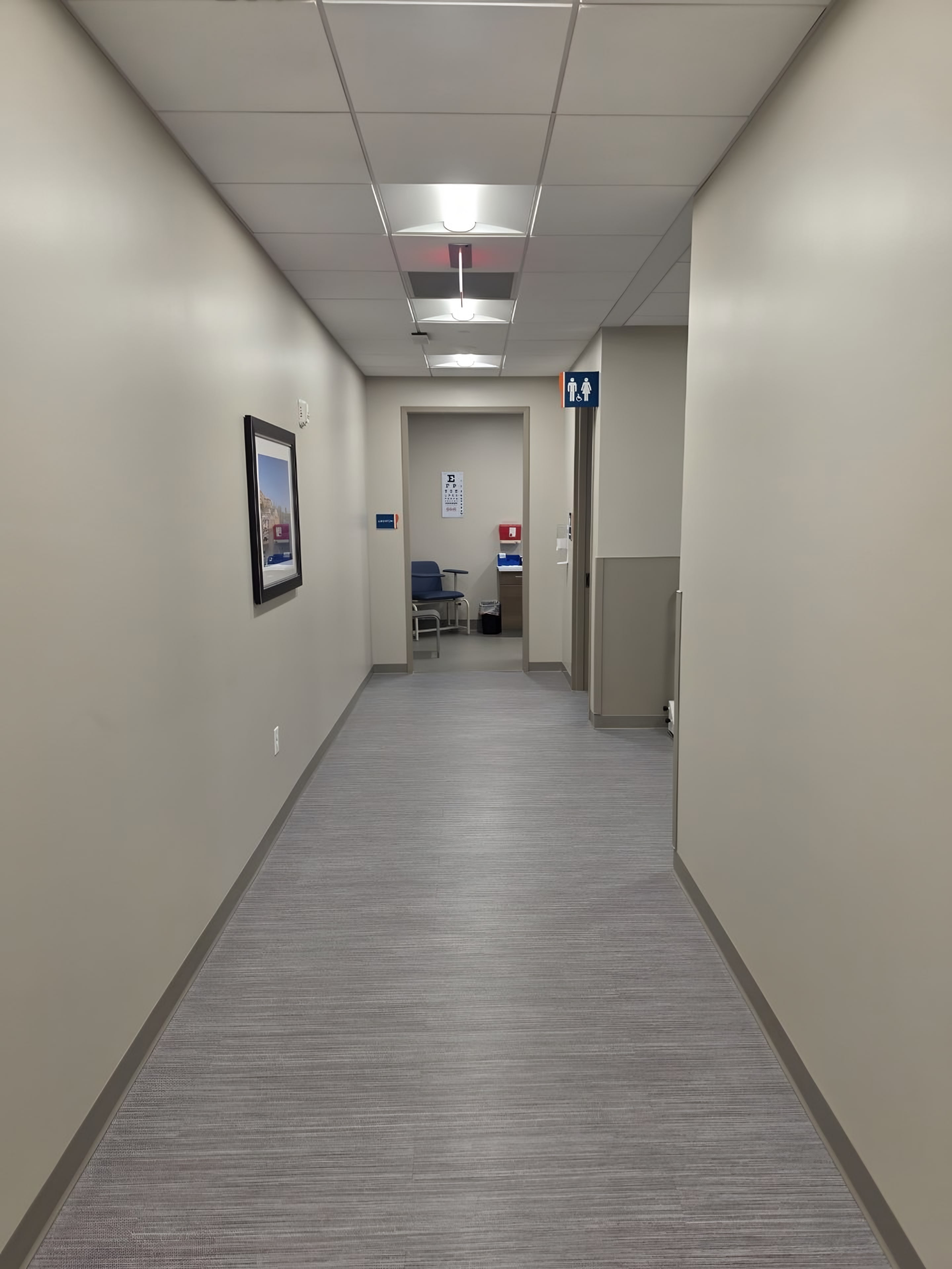 A painted corridor with room signage