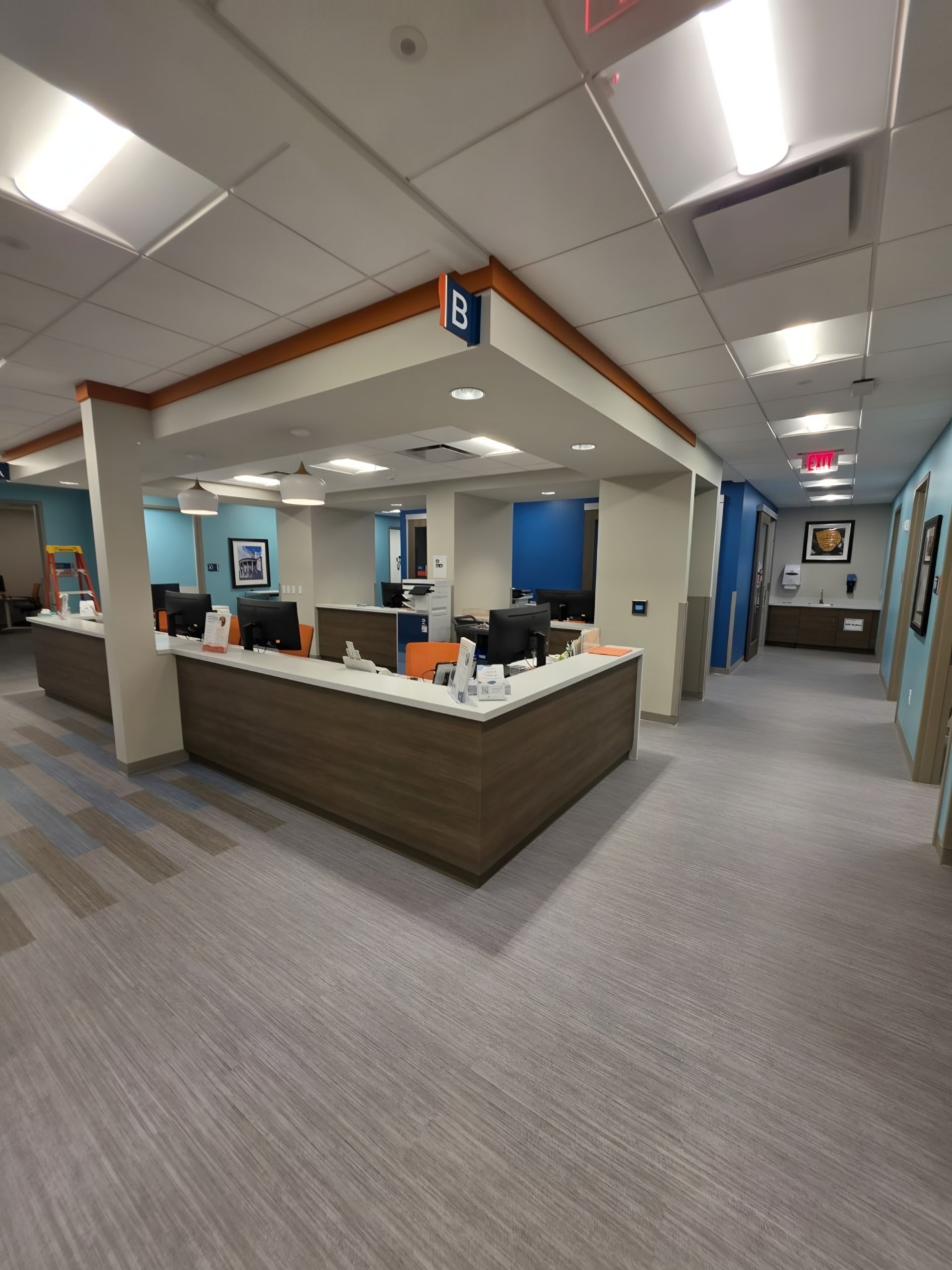 A finished reception and nurse station seen from the corridor