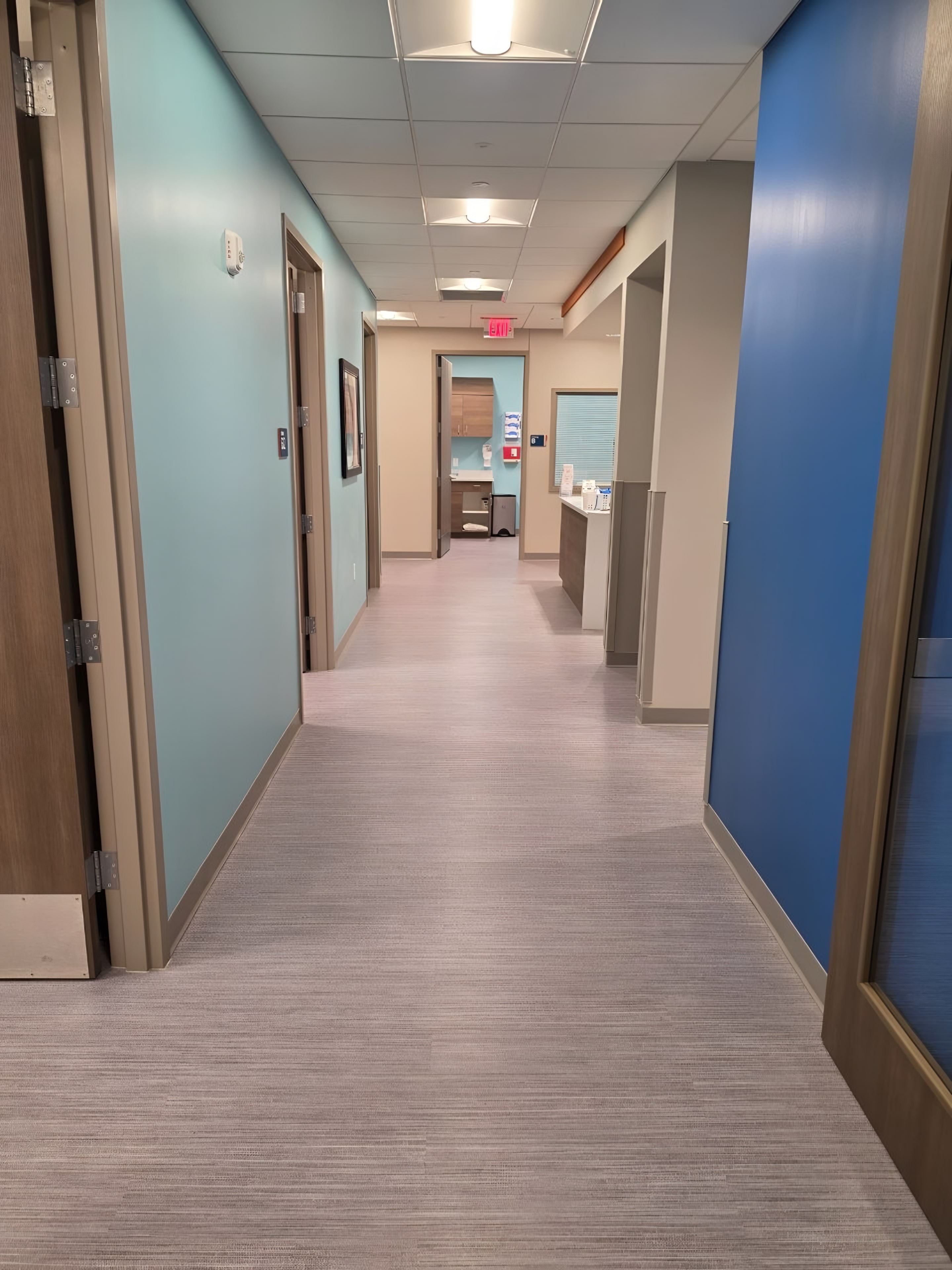 A corridor finished with painted accent walls