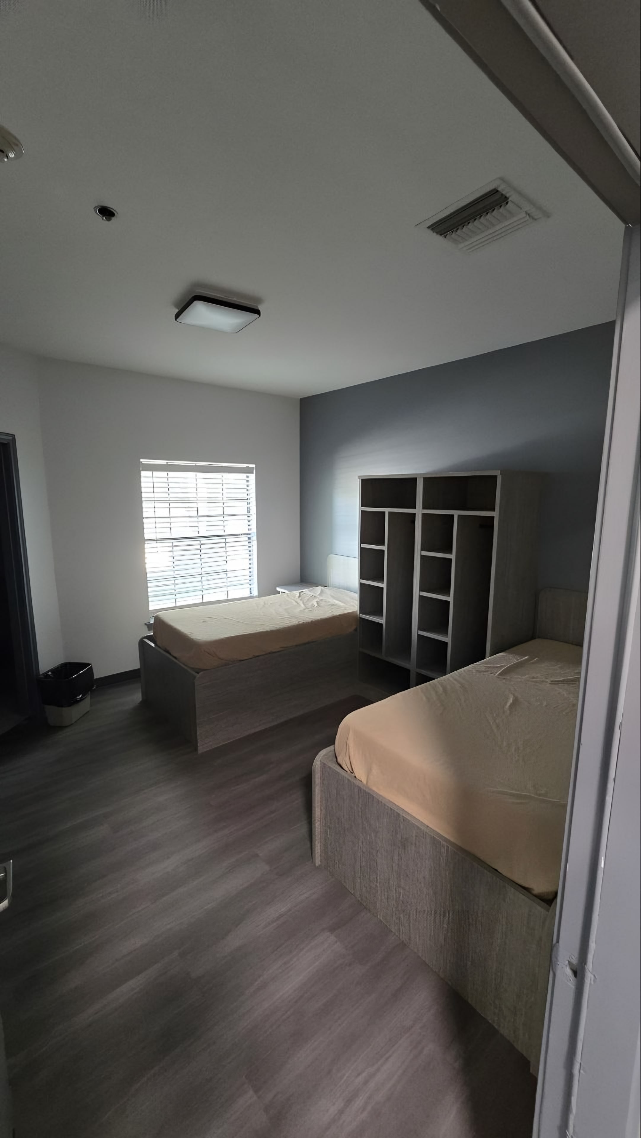 A resident bedroom with a platform bed